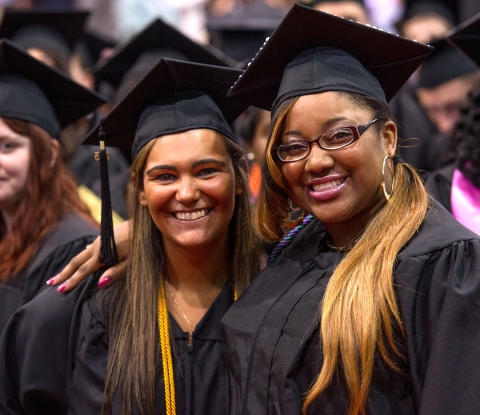 Smiling commencement students
