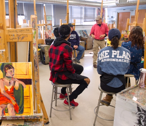 Students and faculty in painting class