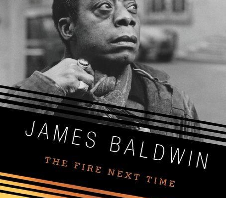 Book cover of The Fire Next Time, showing photo of James Baldwin