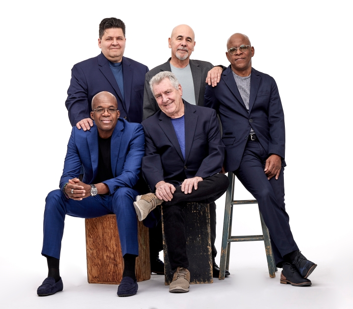 Band members of Spyro Gyra pose for the camera