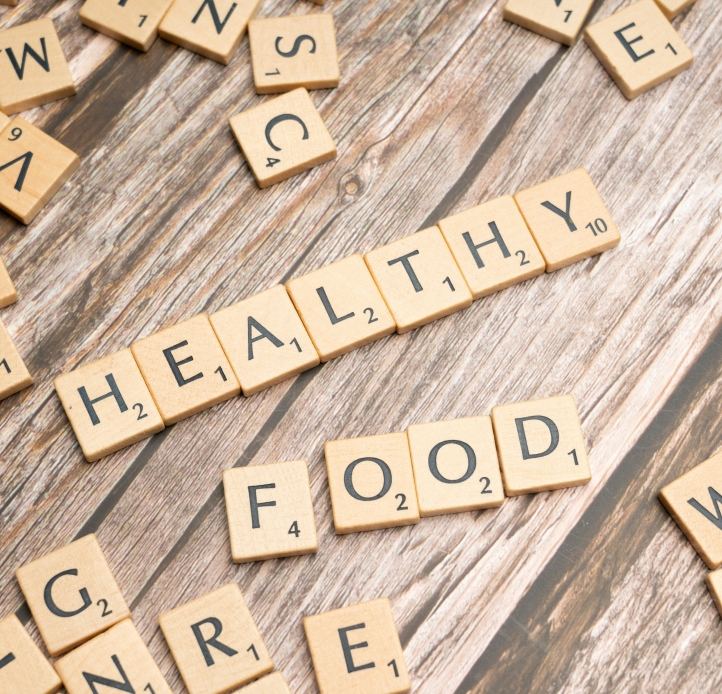 Scrabble pieces spelling the words "Healthy" and "Food"