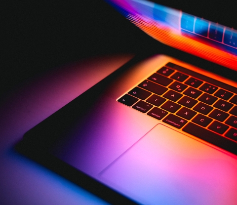 Laptop in brightly-colored lighting