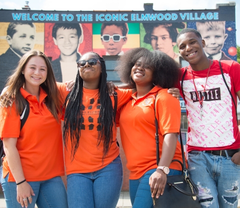 Buffalo State students in front of Elmwood Village mural