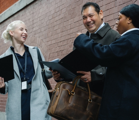 Coworkers chatting on street