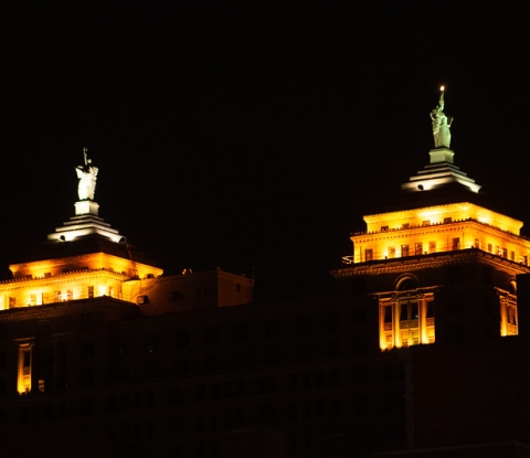 The Liberty Building in downtown Buffalo illuminated orange for the college's 150 anniverary celebration on September 17, 2021