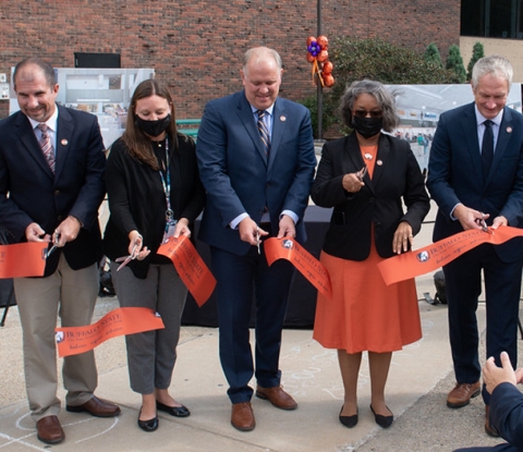President Conway-Turner and others cut the ribbon outside the Academic Commons