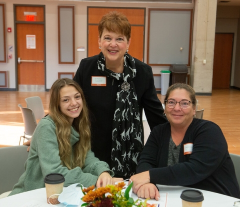 Lee Ann Grace, Former Assistant Dean of International Education, poses with two Buffalo State students at the Scholar Donor Breakfast