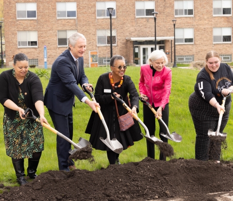 President Conway-Turner and others shovel dirt during the groundbreaking ceremony May 4.