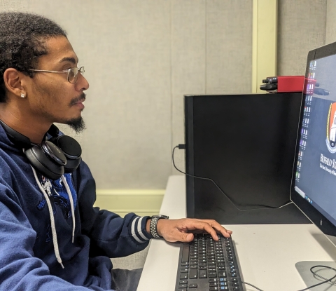 Buffalo State student using a computer