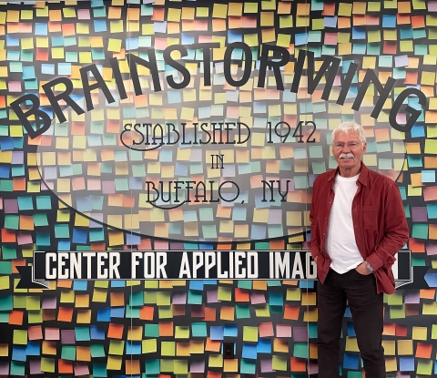 Tim Switalski in front of entrance to Brainstorming Room