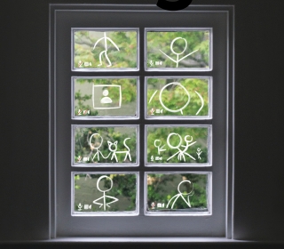 Sukennik's entry showing glass panes with stick figures drawn on