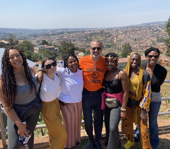 Rwandan visitors a pose on an overpass