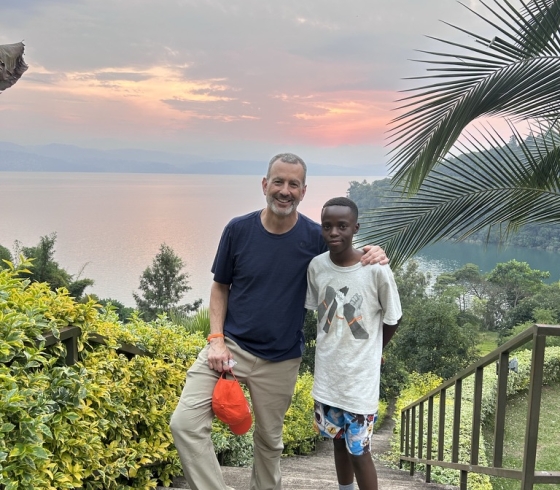 Drew Kahn with Rwandan child
