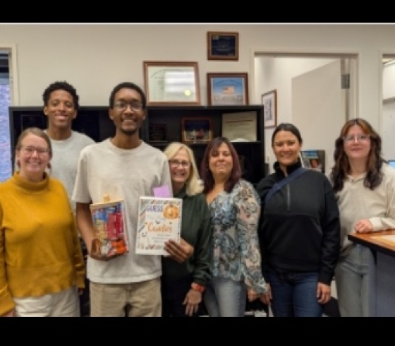 A group of students and staff with the candy raffle winner