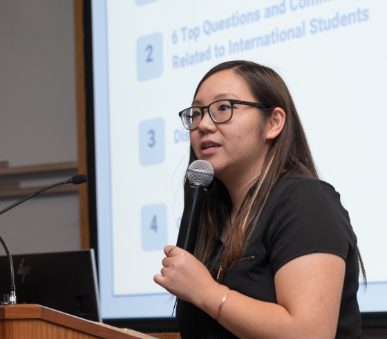 Vicky Lee speaking into a microphone