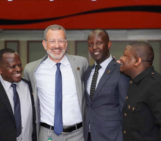 Drew Kahn and members of Rwandan community