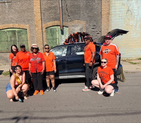 Buffalo State faculty, staff, and students in front of Juneteenth float