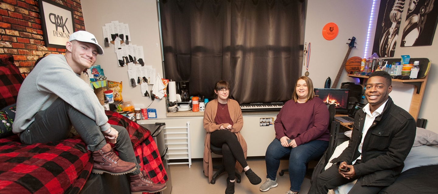 Students sitting in dorm room 