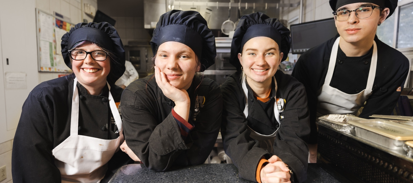 Buffalo State students wear chef uniforms