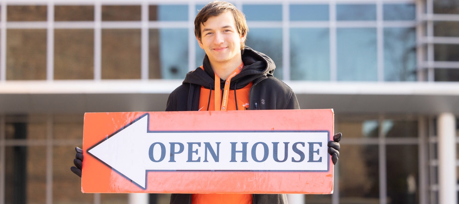 Student with Open House sign