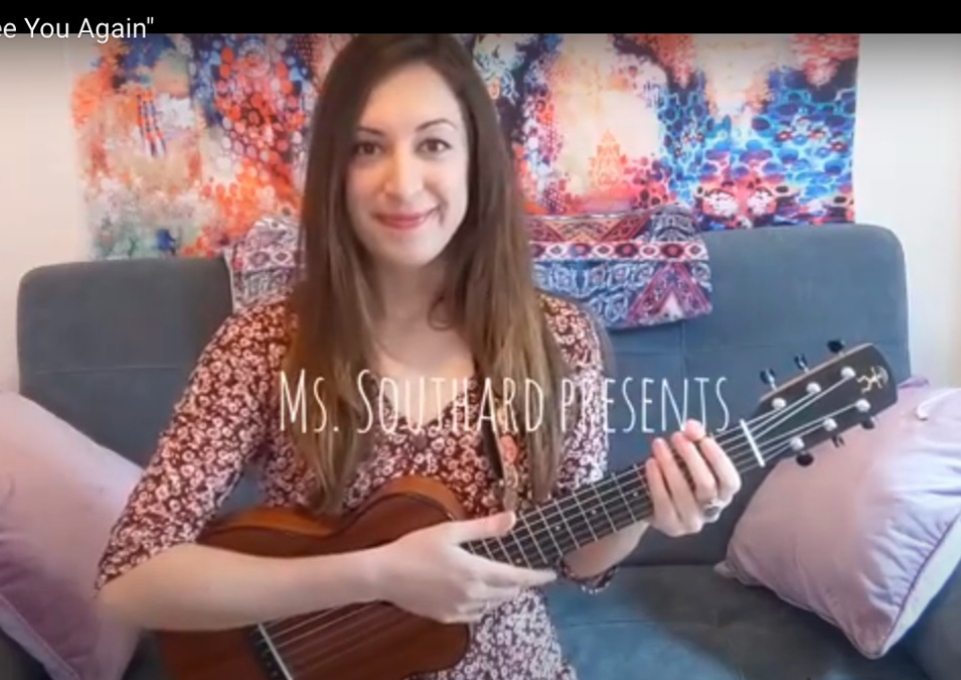 Ms. Southard holding a guitar