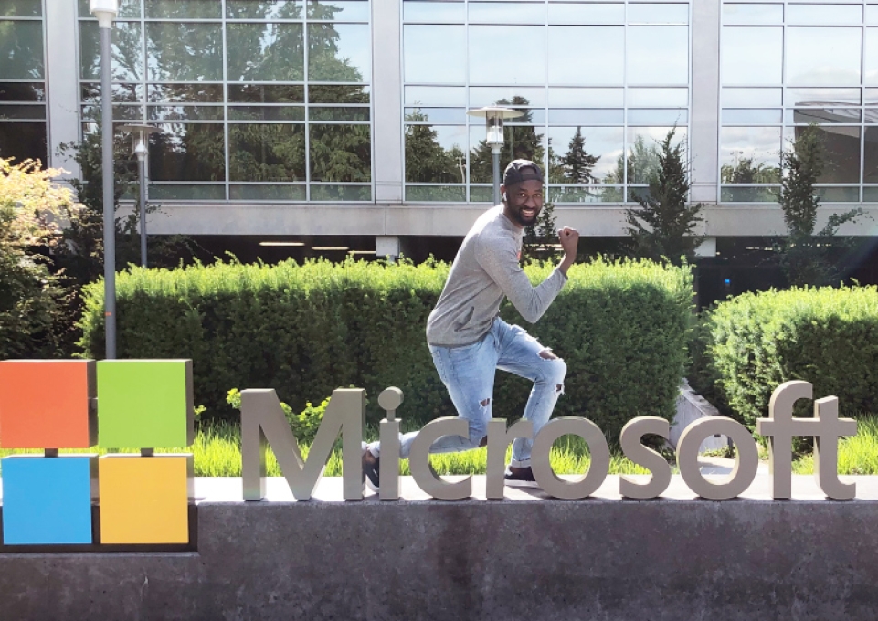 Mohamed Koanda posing on a Microsoft sign