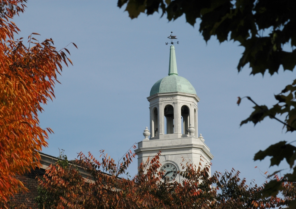 Rockwell Hall bell tower behind screen of fall leaves