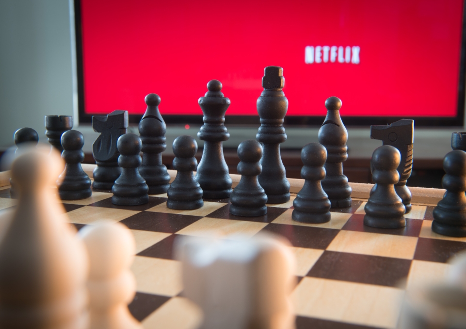 Netflix screen behind a chess set