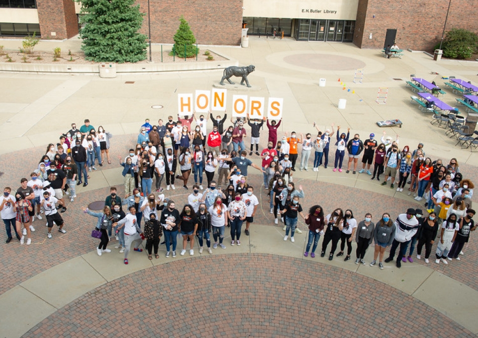 Aerial view of honors students lined up in the Plaza, arranged to form the number 150