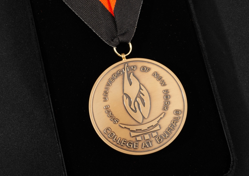 Closup of the President's Medal on a black velvet background