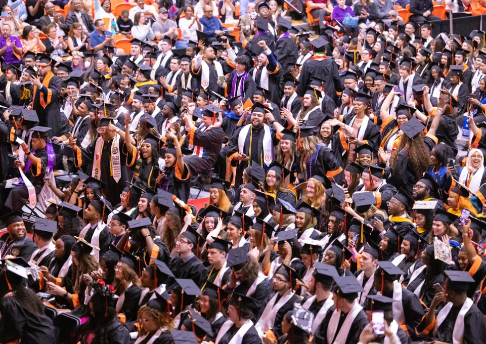 Large crowd of graduates in their caps and gowns