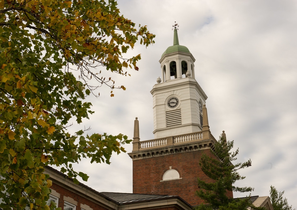 Bell tower of Rockwell Hall framed by trees