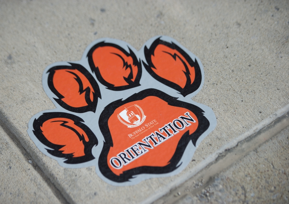 A paw print that reads "orientation"