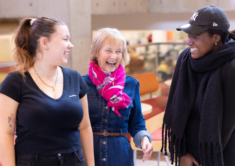 Linda Hawkes with two current exchange students