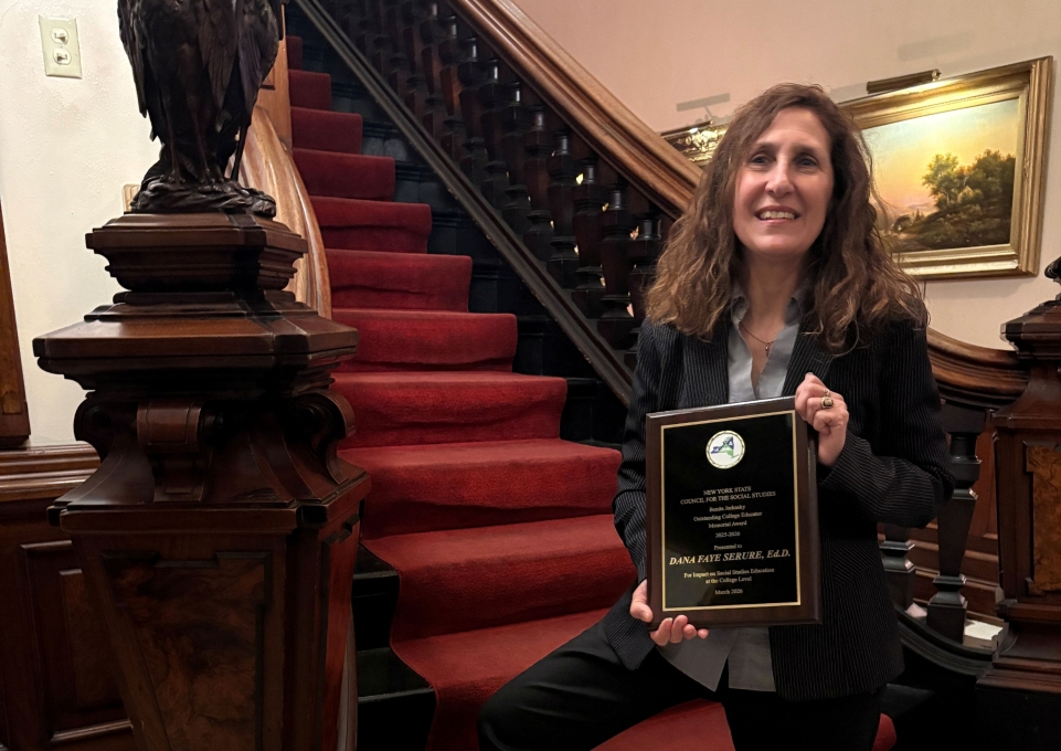Dana Serure holding her award