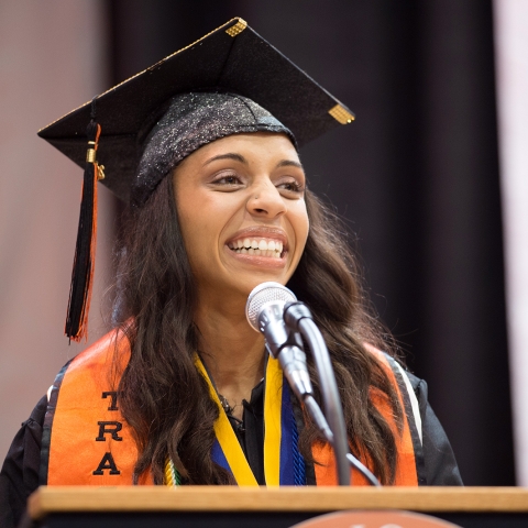 Sasa Vann at the podium during commencement